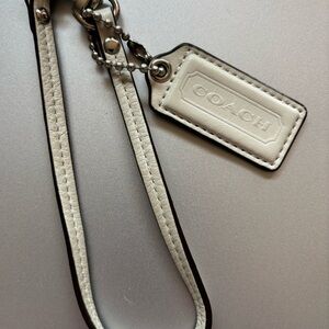 Coach Cream Leather Wristlet with Black Edge Trim